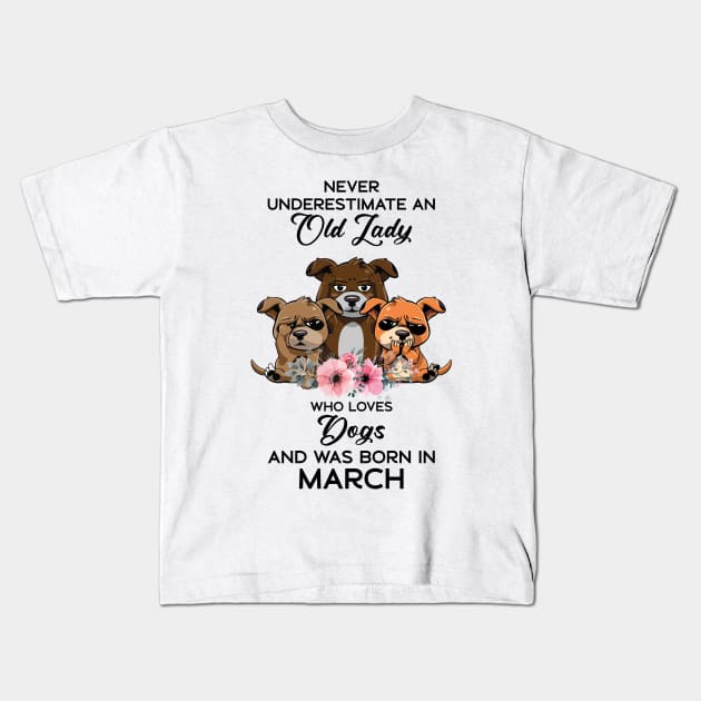 Never Underestimate An Old Woman Who Loves Dogs And Was Born In March Kids T-Shirt by Happy Solstice